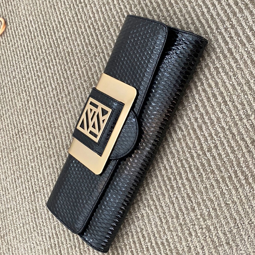 Anne Klein black patent leather clutch with gold hardware
